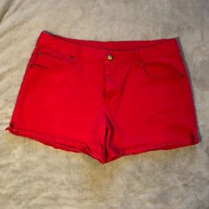Fun red mid rise button flap shorts. Size 16